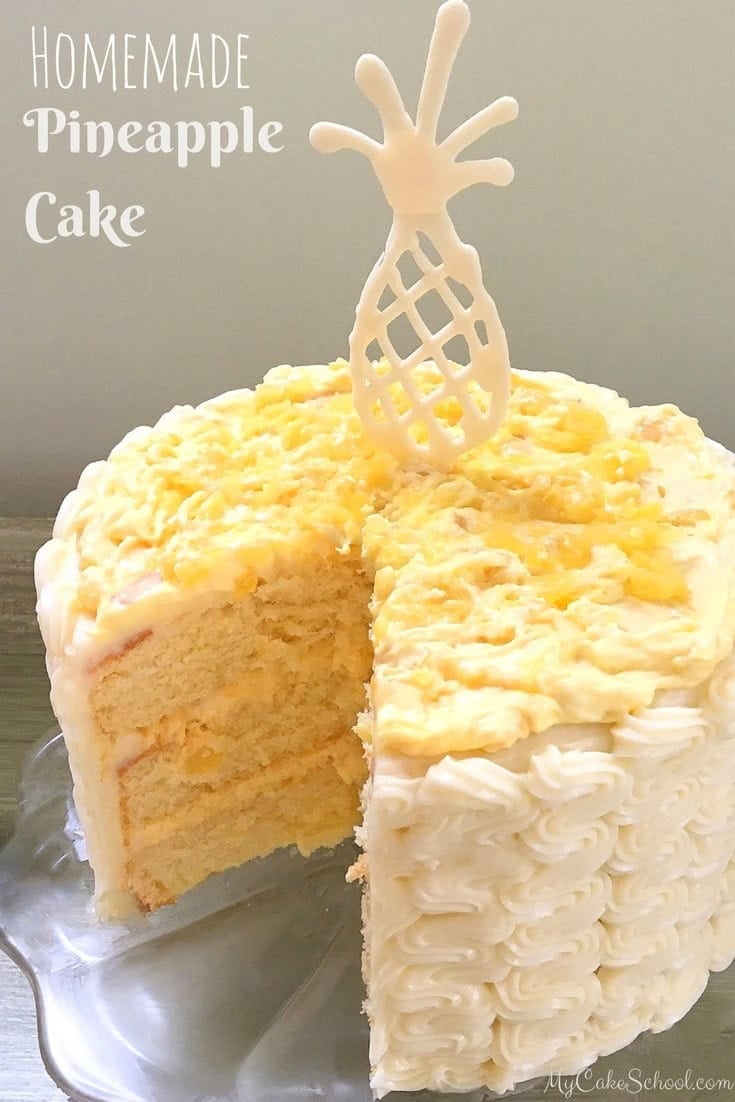 Pineapple Cake, sliced, on a pedestal.