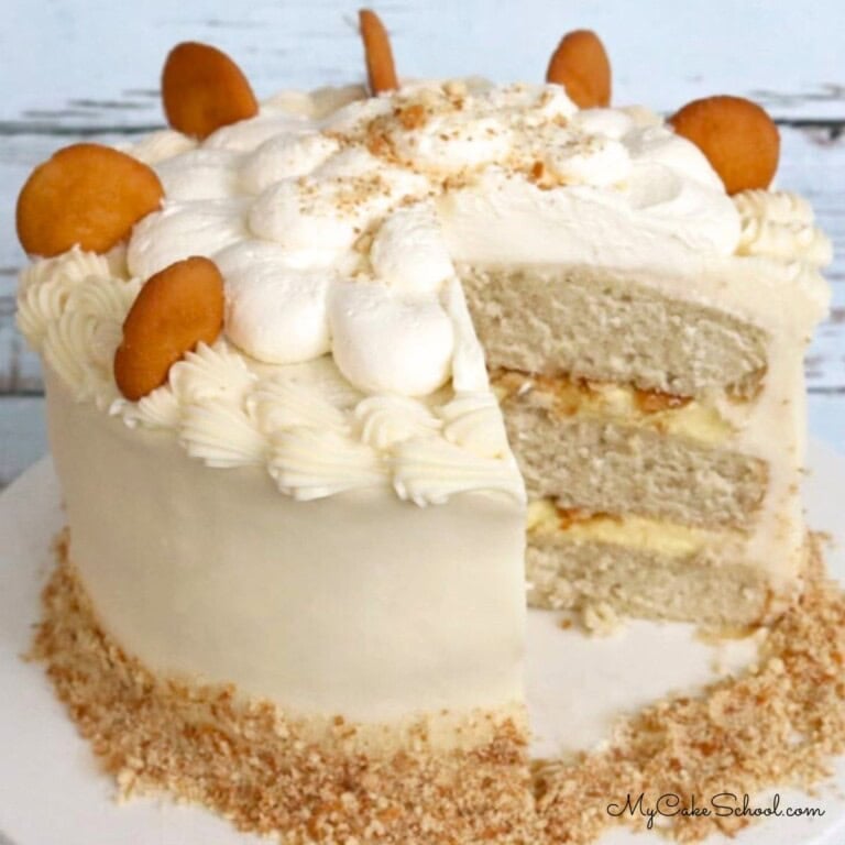 Sliced Banana Pudding Cake on a cake pedestal.