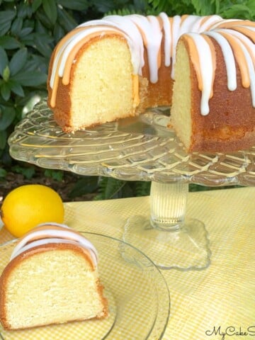 Lemon Orange Pound Cake, sliced, on a cake pedestal.