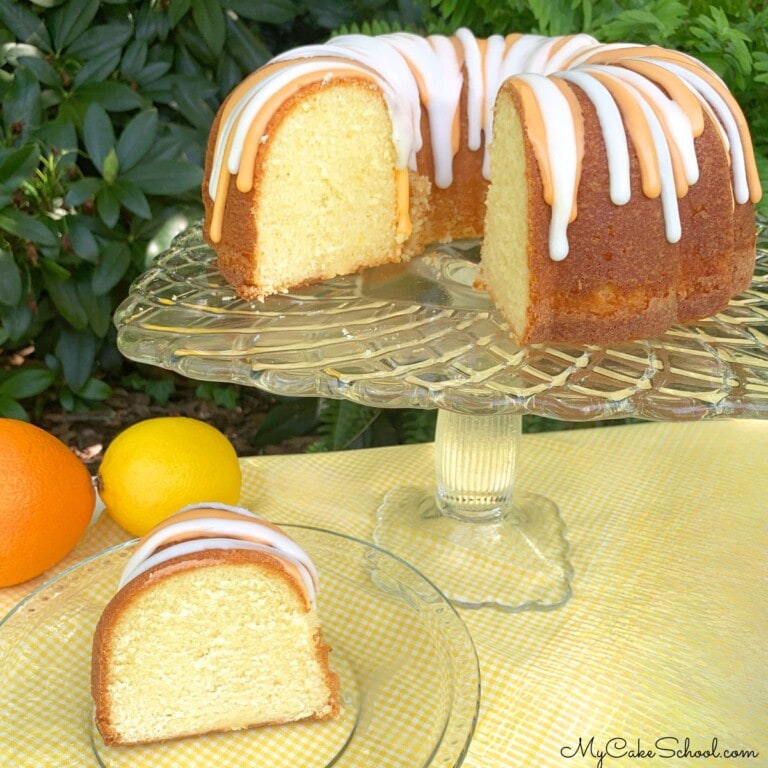 Lemon Orange Pound Cake, sliced, on a cake pedestal.