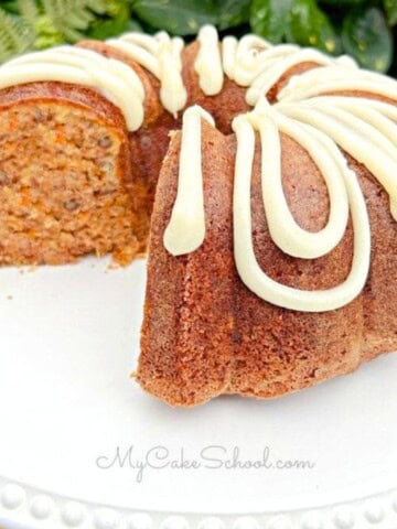 Carrot Bundt Cake, sliced, on a cake plate.