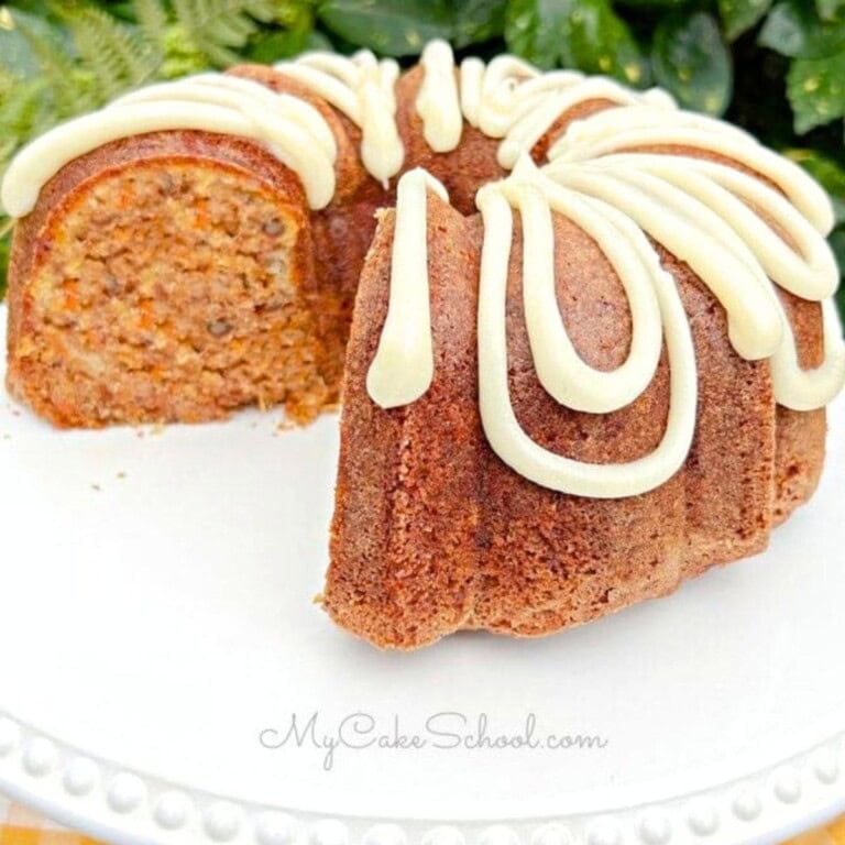 Carrot Bundt Cake, sliced, on a cake plate.