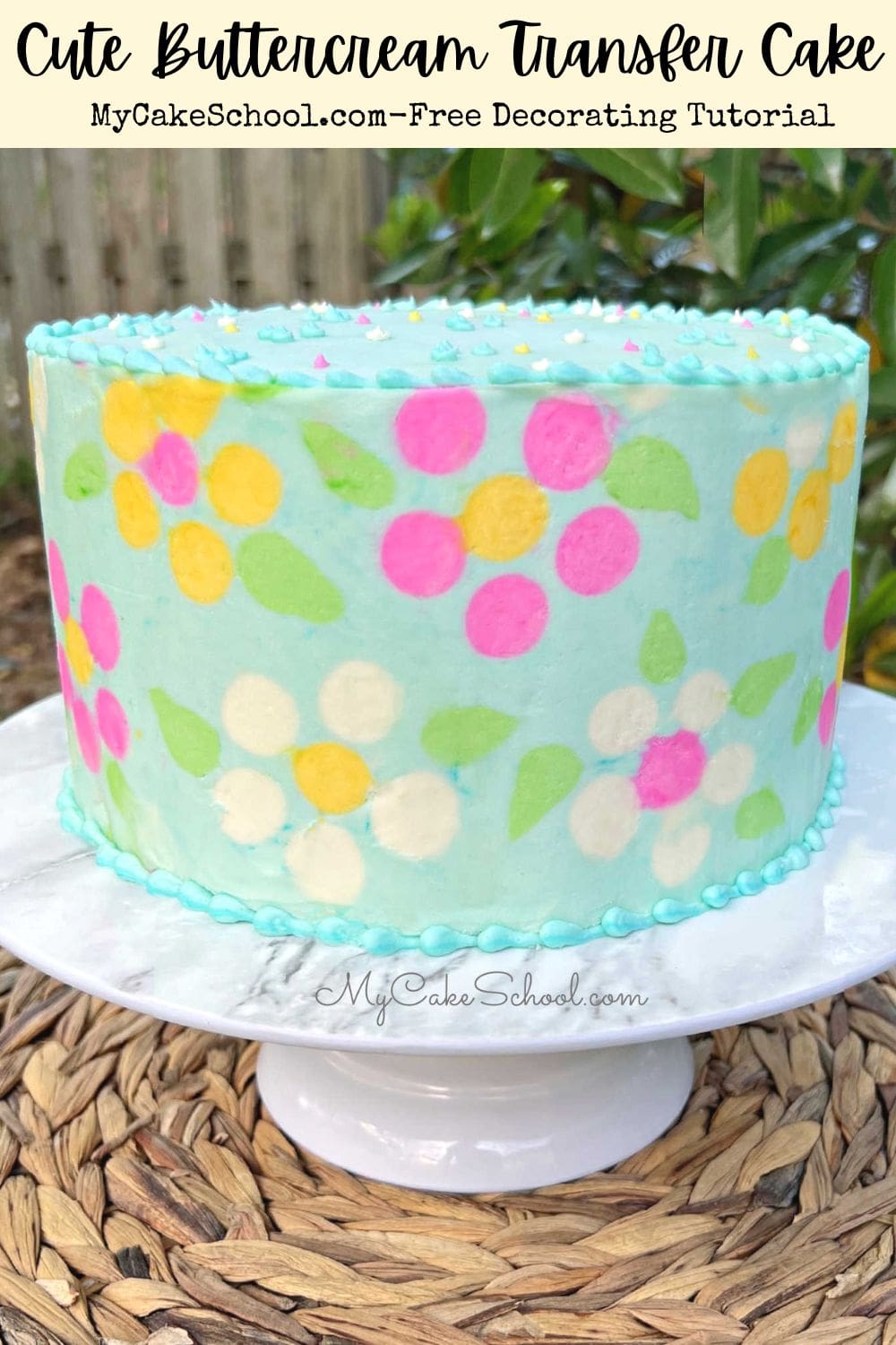 Buttercream-frosted cake, blue with colorful daisies-smooth finish.
