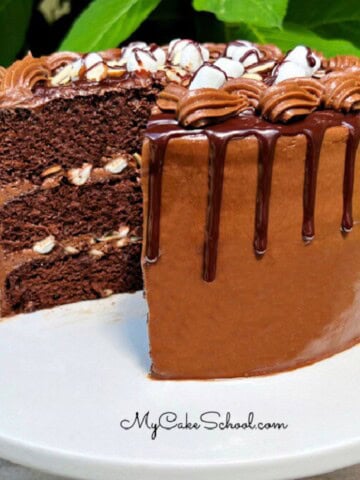 Rocky Road Cake, sliced, on a cake pedestal.