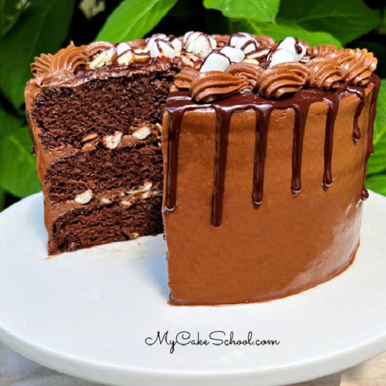 Rocky Road Cake, sliced, on a cake pedestal.