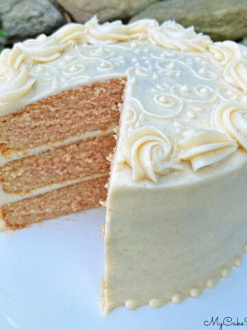 Applesauce Spice Cake, sliced, on a cake pedestal.