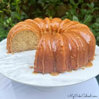 Banana Pound Cake, sliced, on a pedestal.