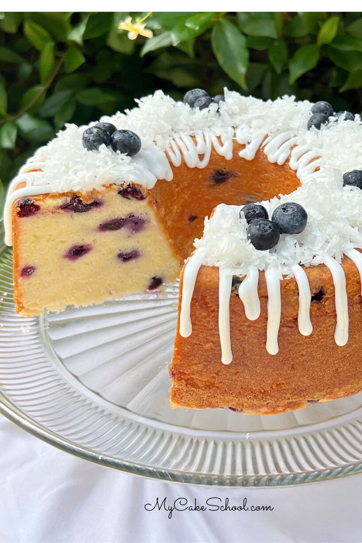 Blueberry Coconut Pound Cake on a cake pedestal.