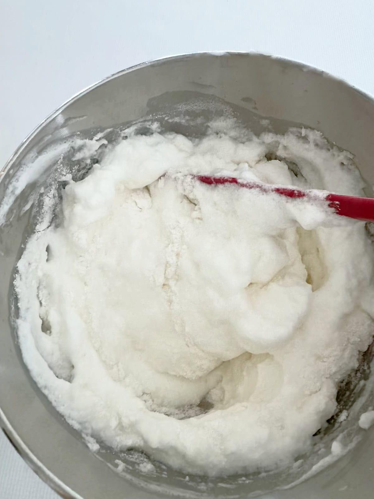 Whipped Egg Whites in a bowl.