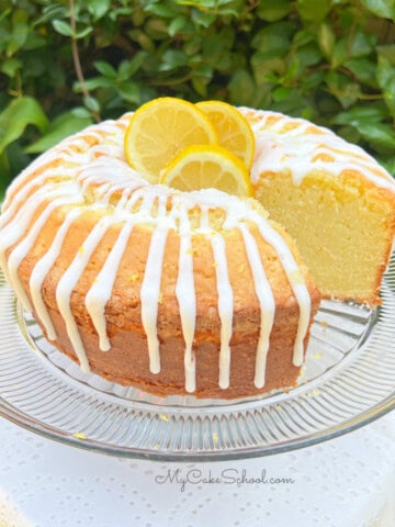 Lemon Mascarpone Pound Cake, sliced, on a pedestal.