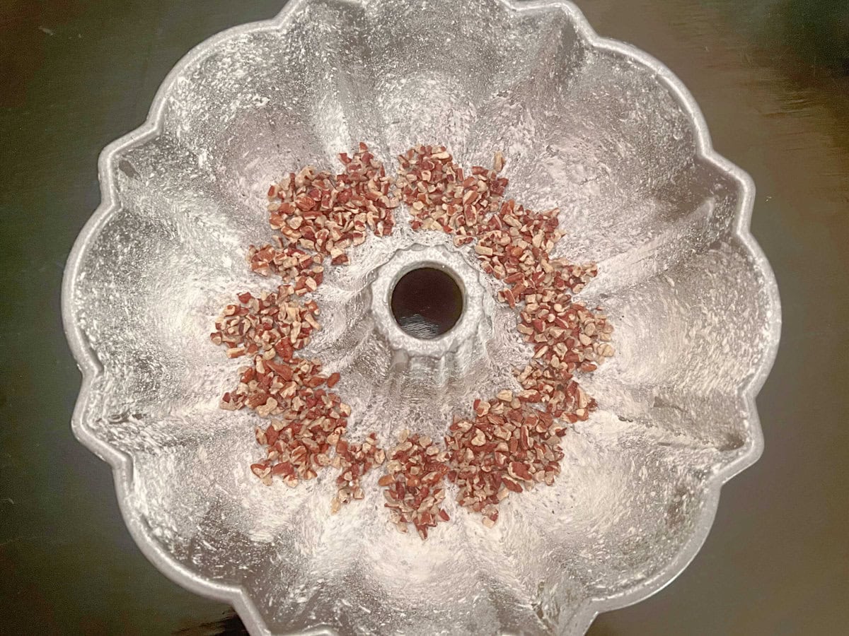 Chopped pecans sprinkled into the bottom of prepared bundt pan.