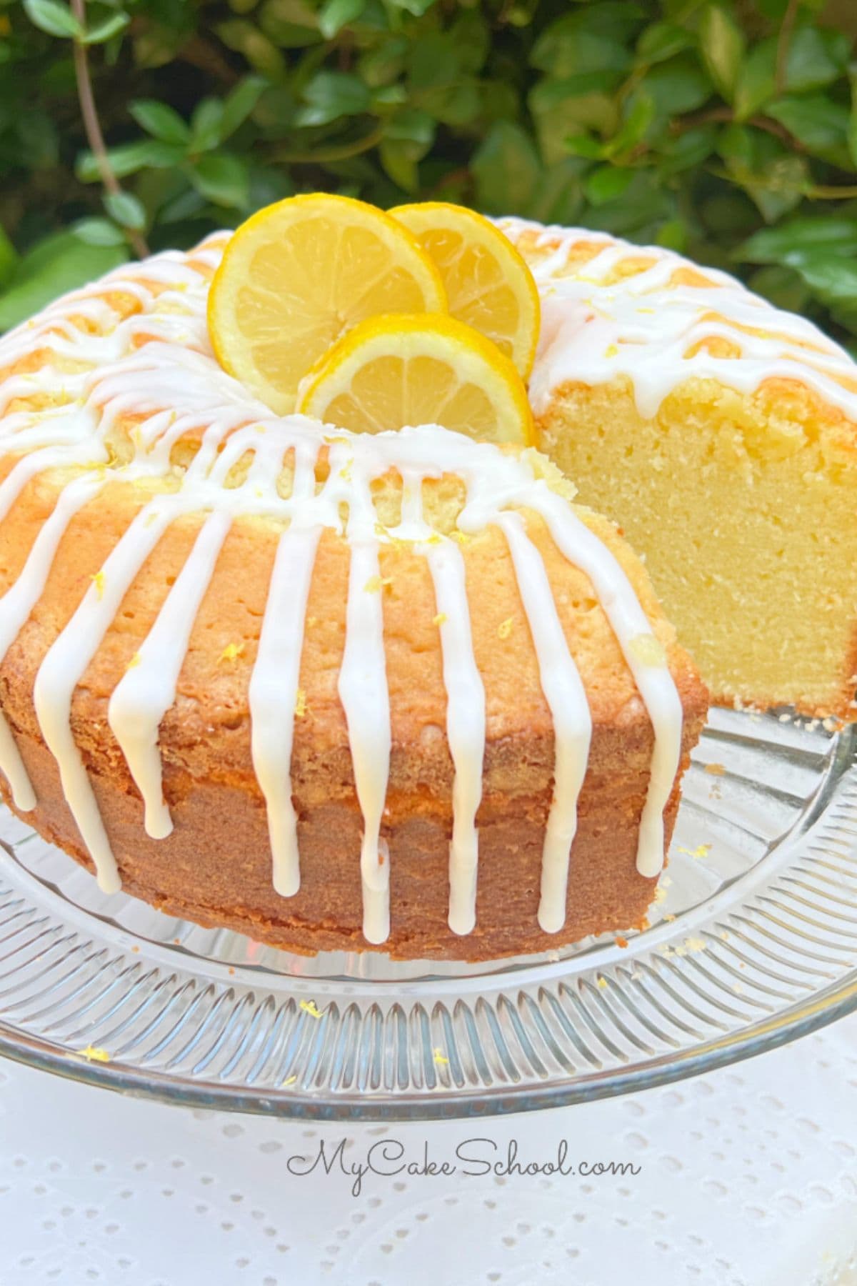 Lemon Mascarpone Pound Cake, sliced, on a pedestal.