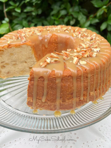 Apple Pound Cake, sliced, on a cake pedestal.