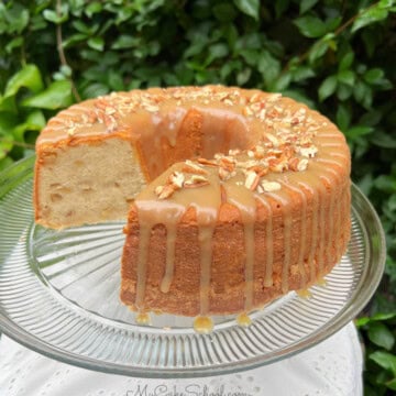 Apple Pound Cake, sliced, on a pedestal.