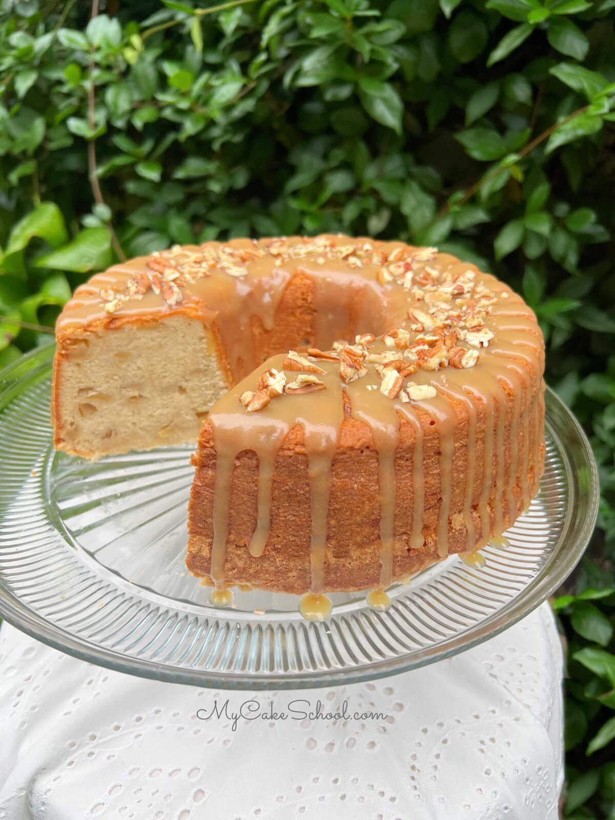 Apple Pound Cake, sliced, on a pedestal.