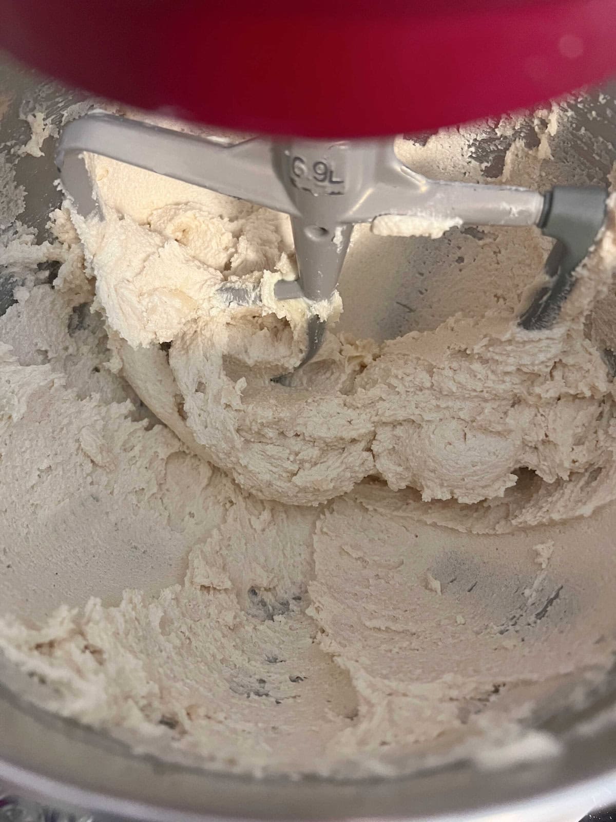 Creaming the butter and sugar in the mixing bowl.