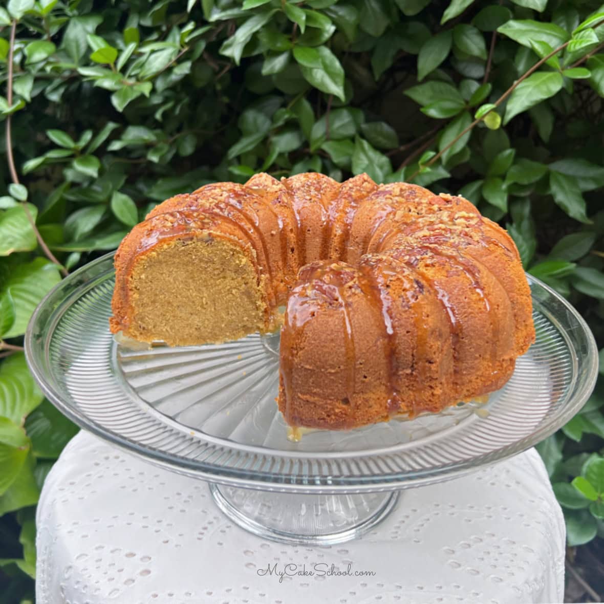 Sweet Potato Pound Cake, sliced, on a pedestal.