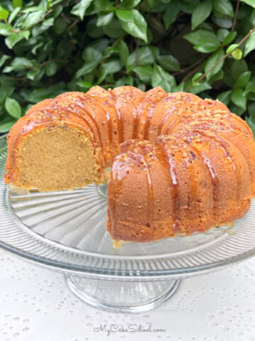 Sweet Potato Pound Cake, sliced, on a pedestal.