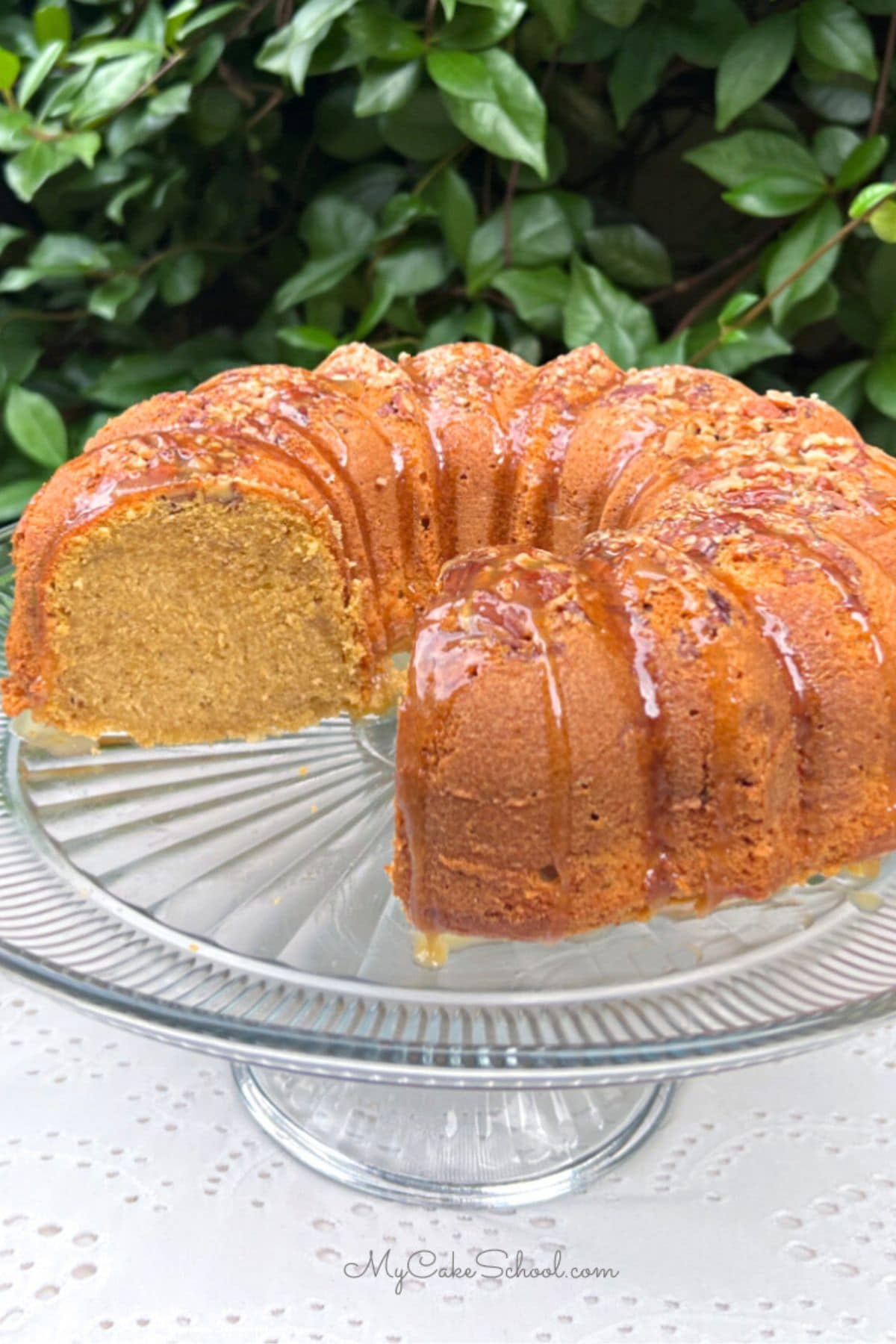 Sweet Potato Pound Cake, sliced, on a pedestal.