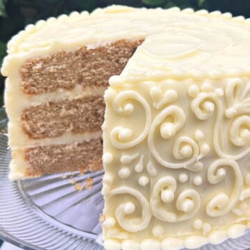 Chai Cake, sliced, on a cake pedestal.