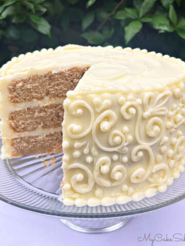 Chai Cake, sliced, on a cake pedestal.