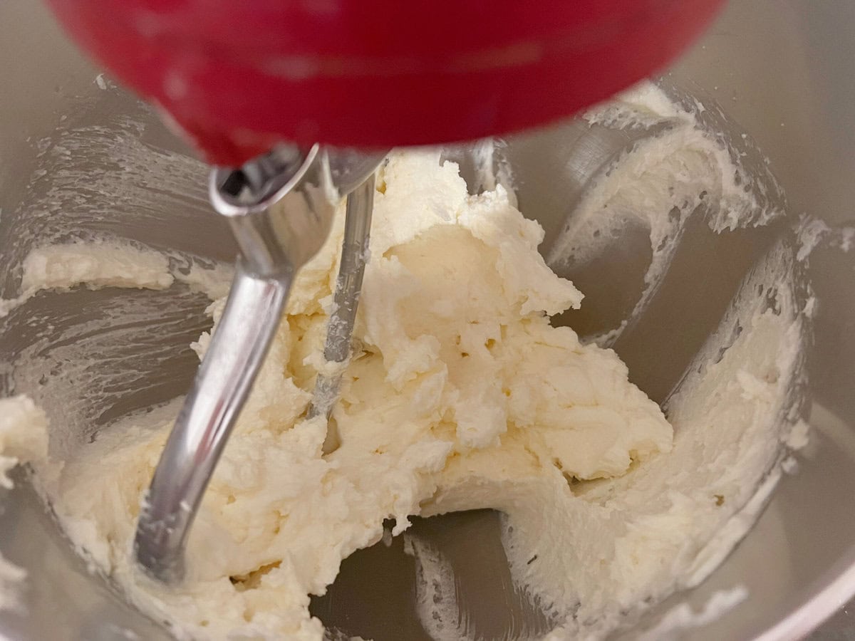 Mixing the butter, mascarpone, and sugar.