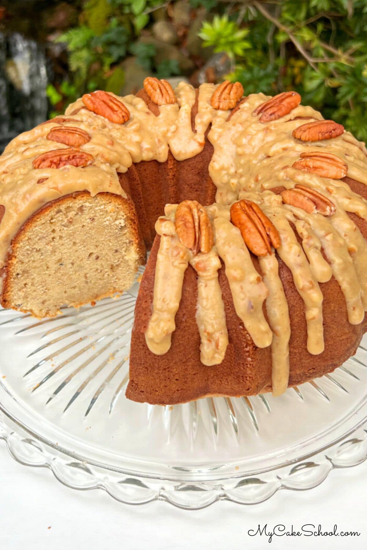 Praline Pound Cake, sliced, on a cake pedestal.