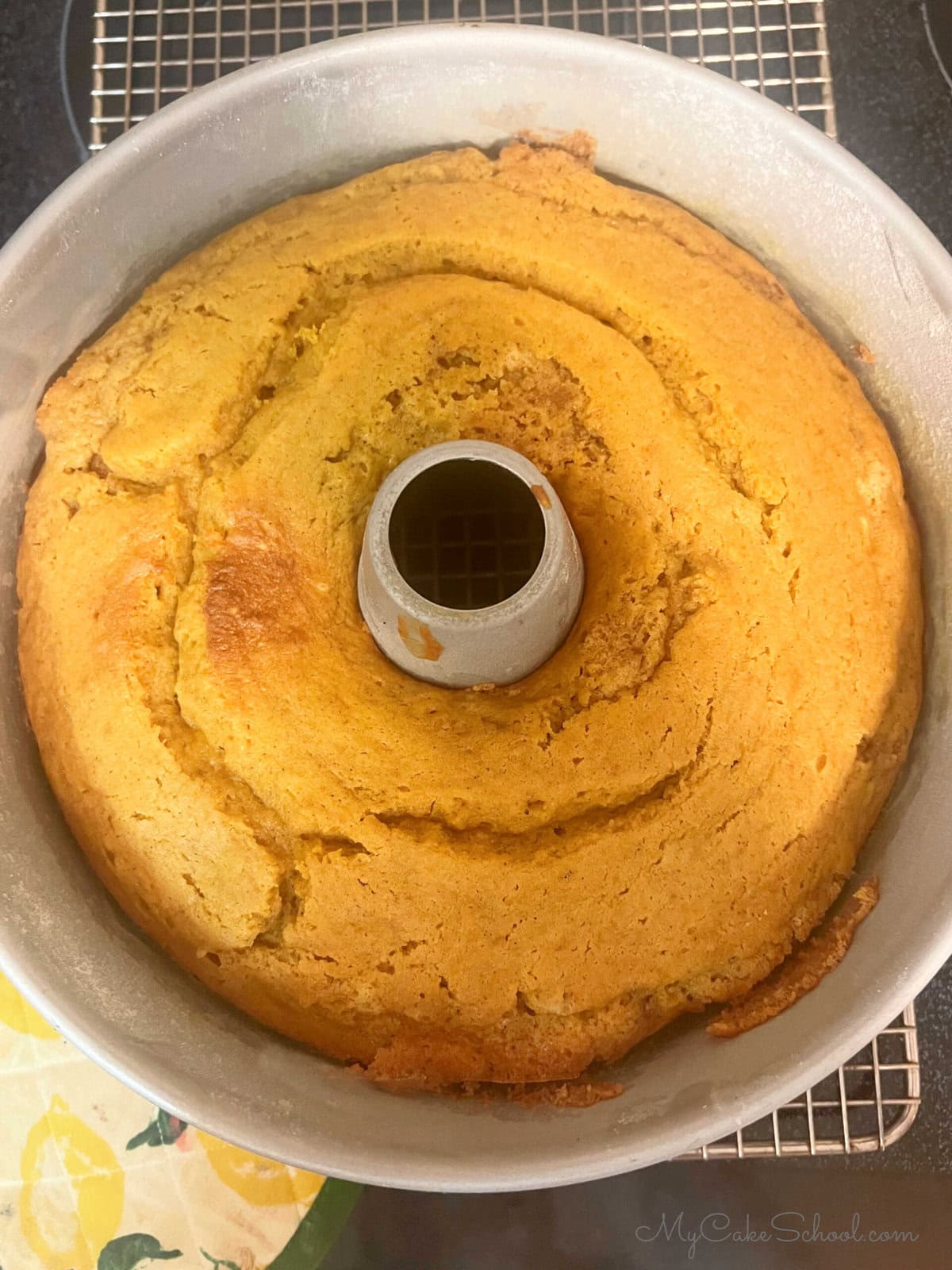 Baked Pumpkin Snickerdoodle Bundt Cake, cooling on wire rack.