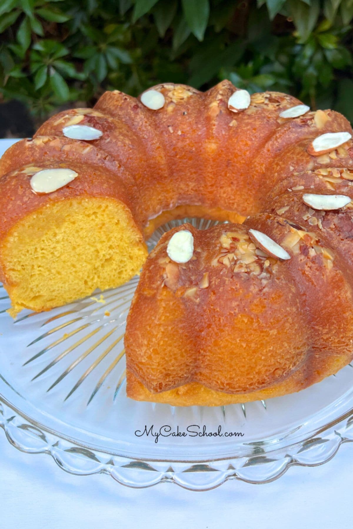 Closeup of sliced Almond Rum Cake on a cake plate.