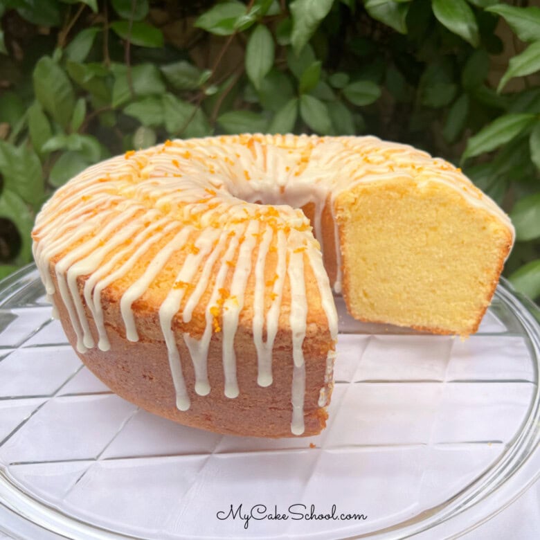 Orange Pound Cake, sliced, on a cake plate.