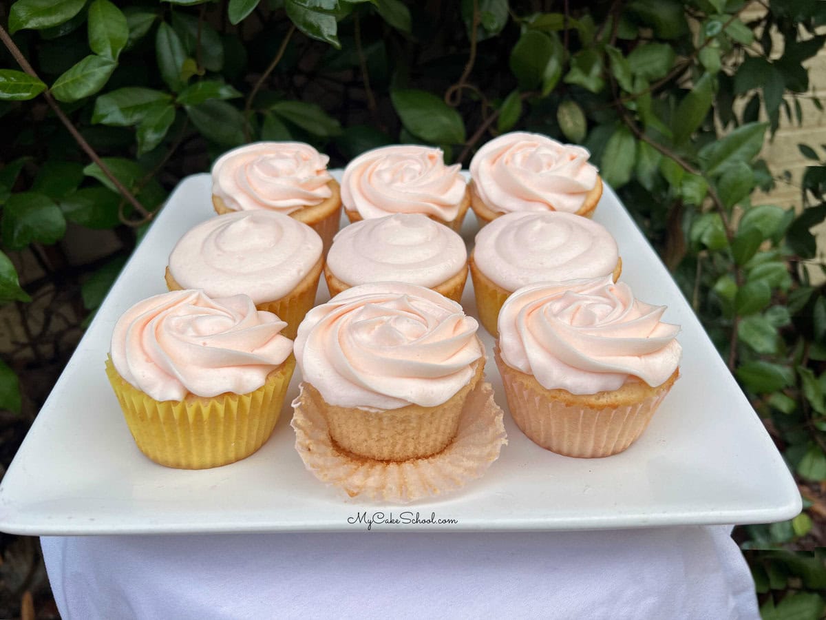 Pink Champagne Cupcakes on a cake platter.