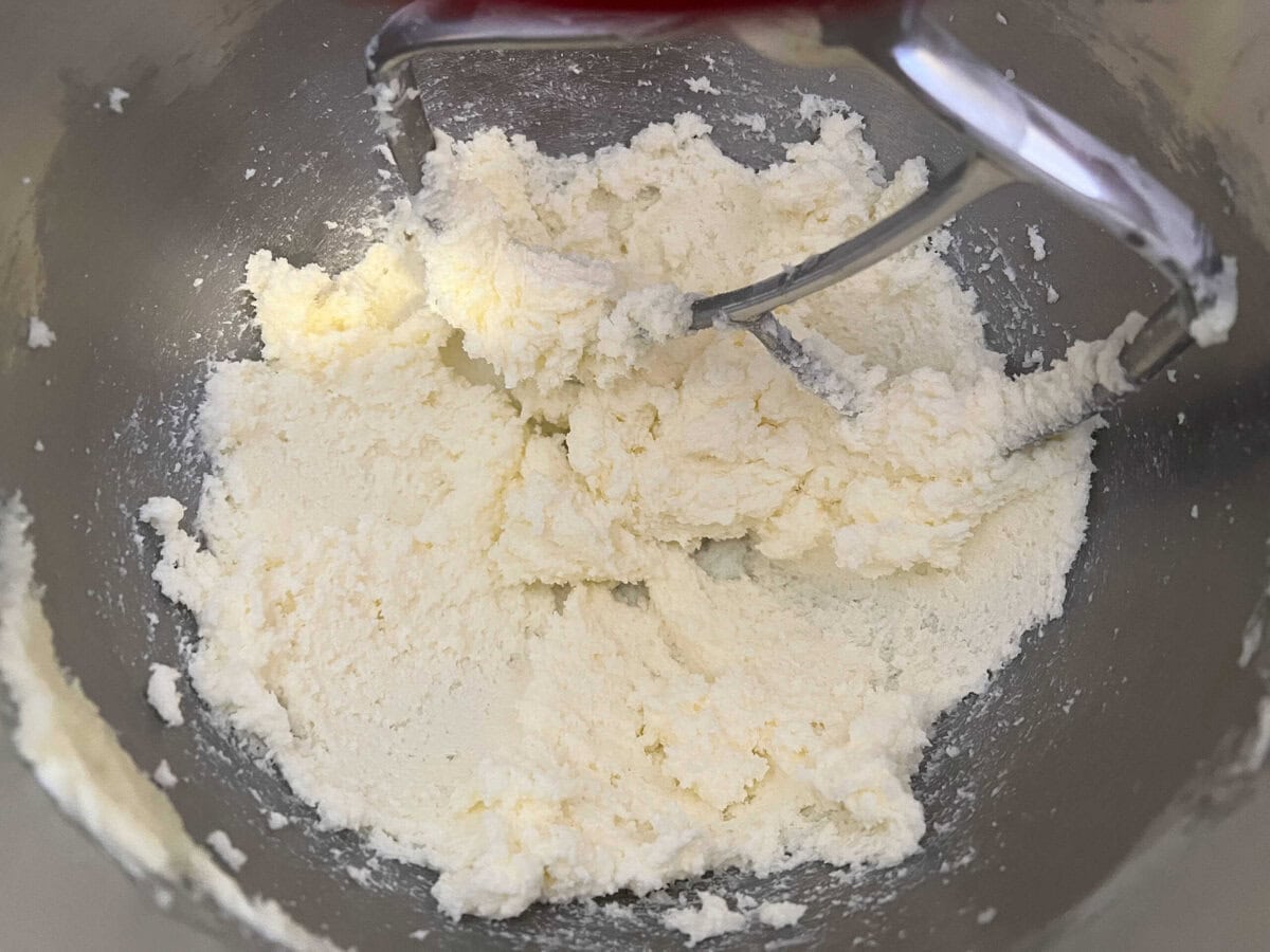 Butter and sugar in a mixing bowl.