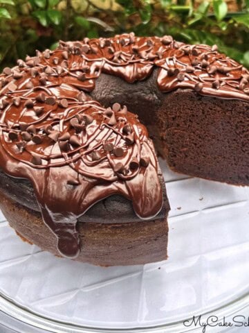 Chocolate Ricotta Cake, sliced, on a cake plate.