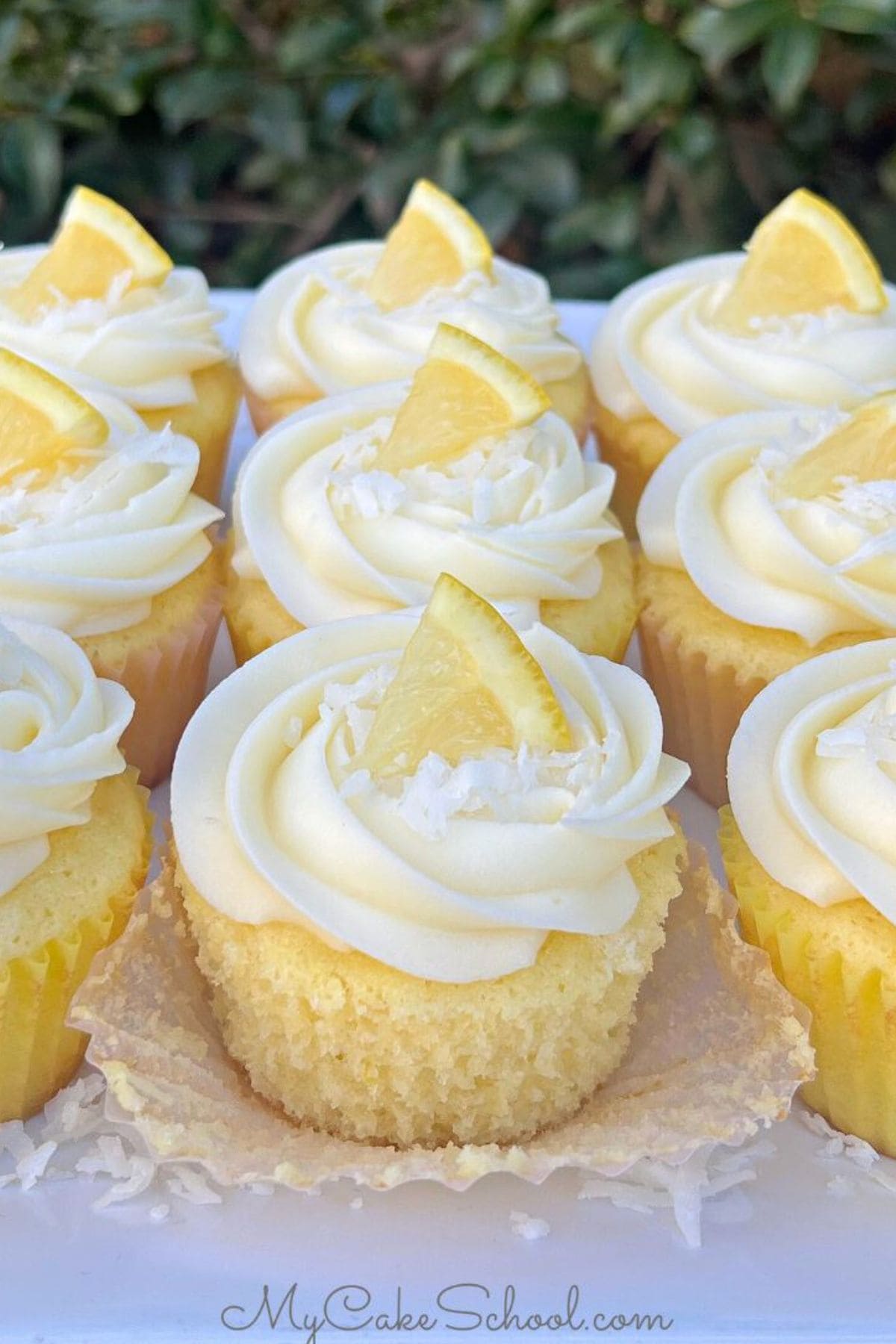 Lemon Coconut Cupcakes on a plate.