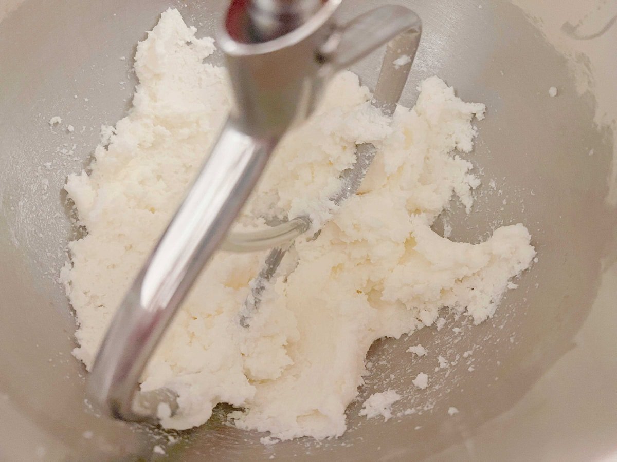 Combining the butter and sugar mixture in mixing bowl.