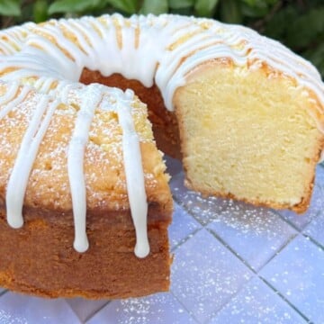 Sliced Lemon Sour Cream Pound Cake on a cake plate.