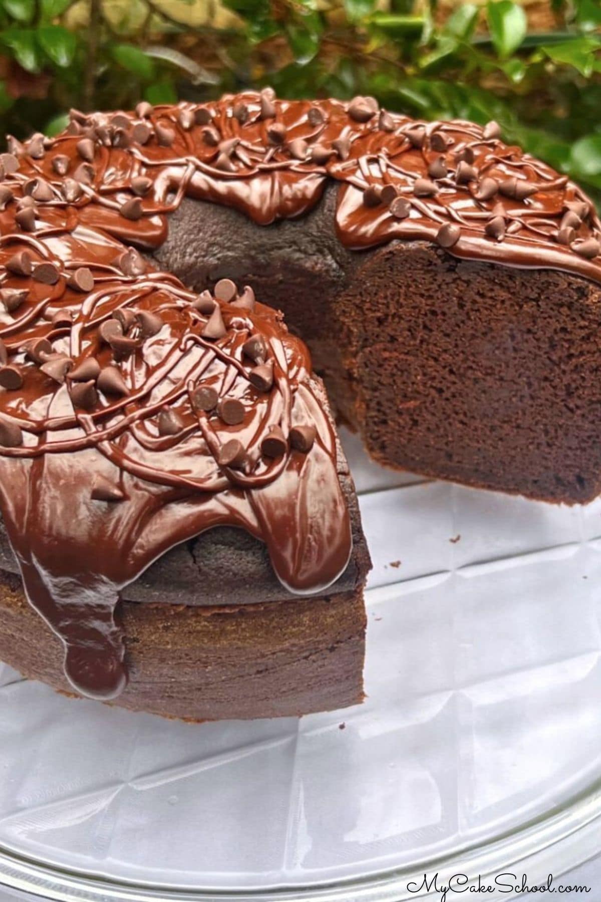 Chocolate Ricotta Cake, sliced, on a cake plate.