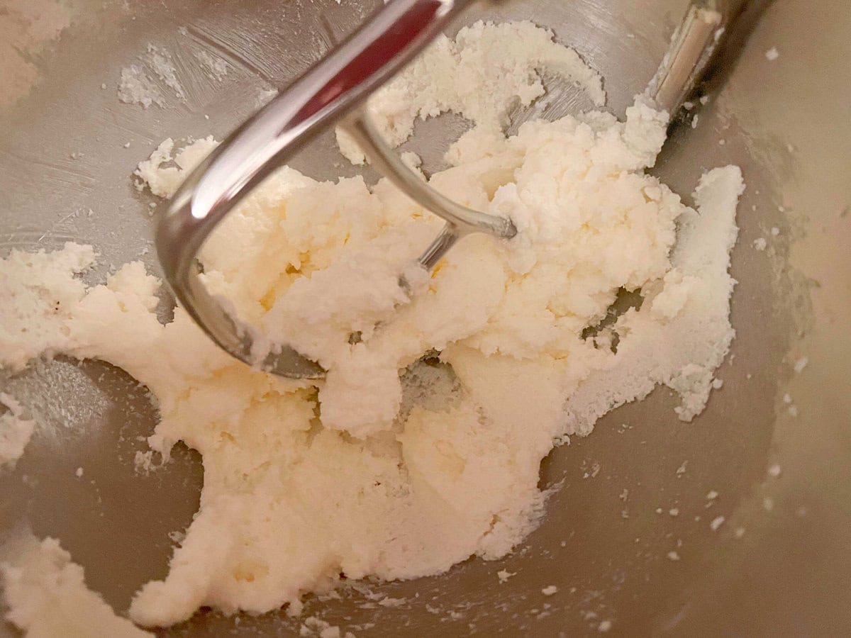 Butter and sugar, mixing in bowl.