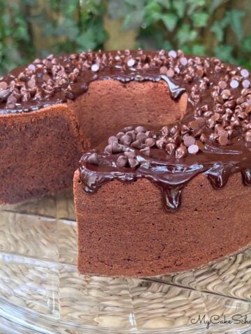 Chocolate Sour Cream Pound Cake, sliced, on a cake platter.