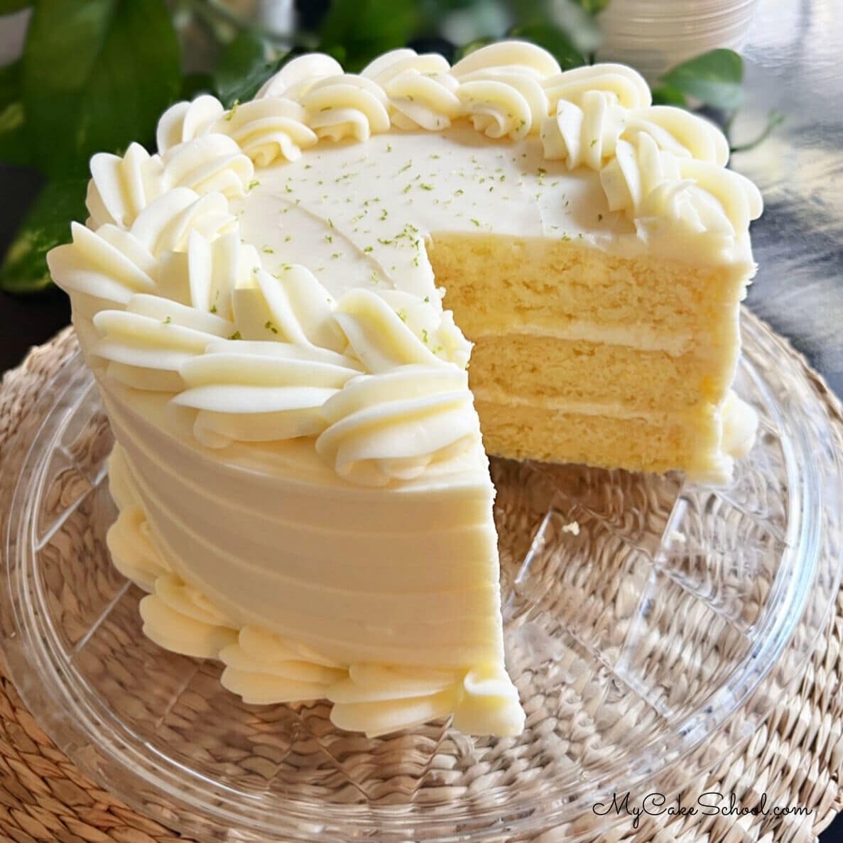 Key Lime Cake, sliced, on a cake plate.