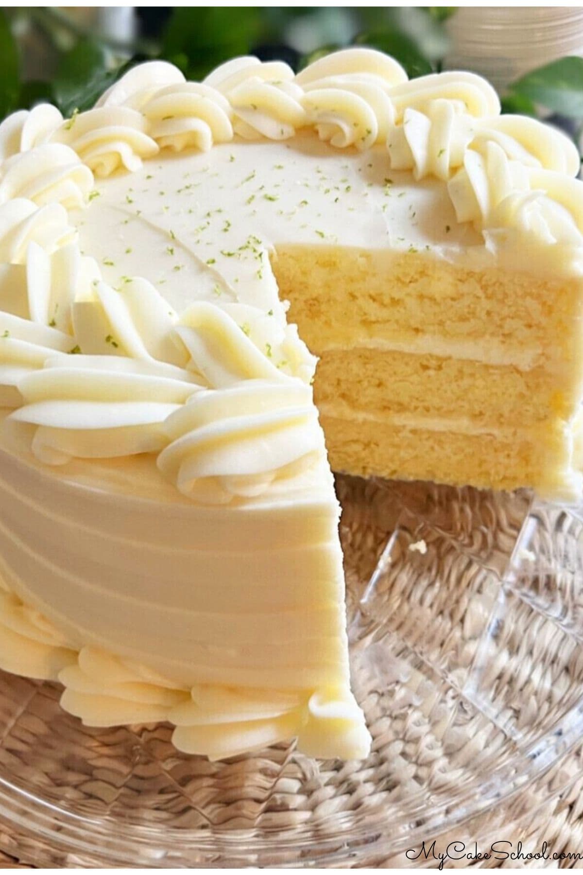 Key Lime Cake, sliced, on a cake plate.