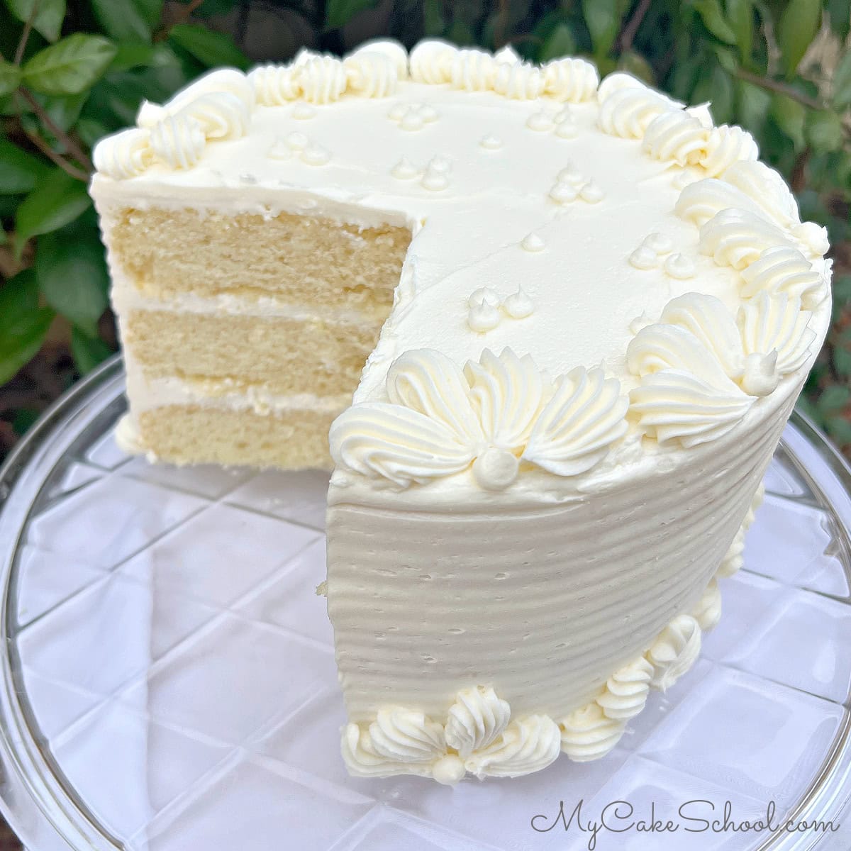 Champagne Velvet Cake, sliced on a cake plate.