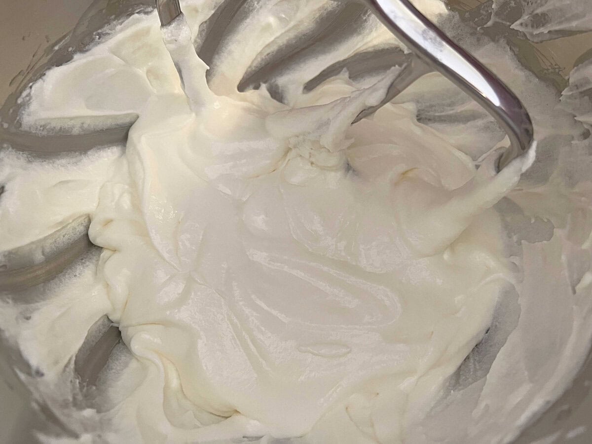 Mixing egg whites into the cake batter.